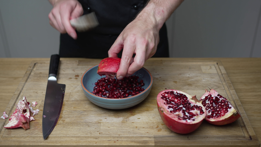 knocking out the seeds out of a pomegranate