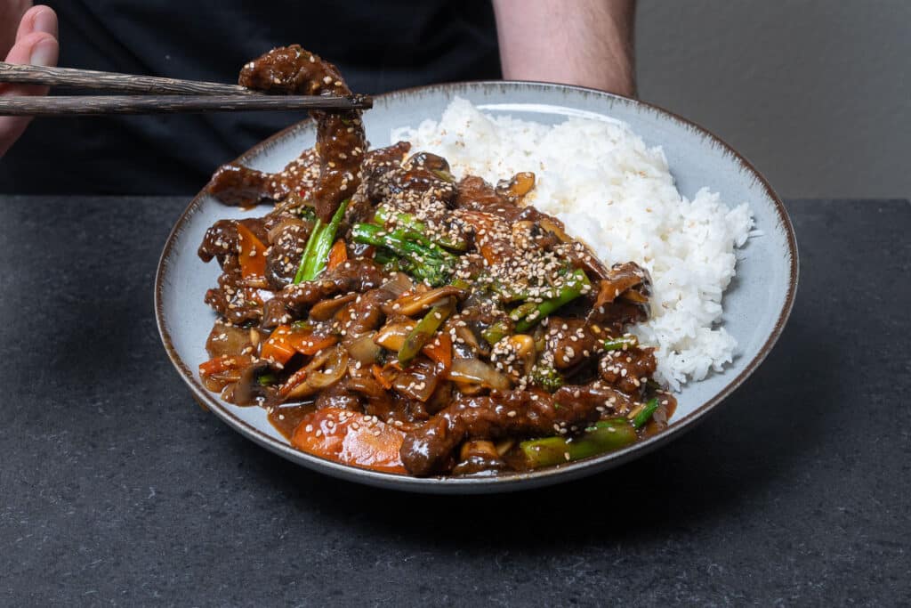 Teriyaki Beef Stir fry served on a plate with jasmin rice